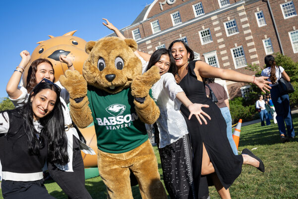 Students pose for a photo with Biz E. Beaver