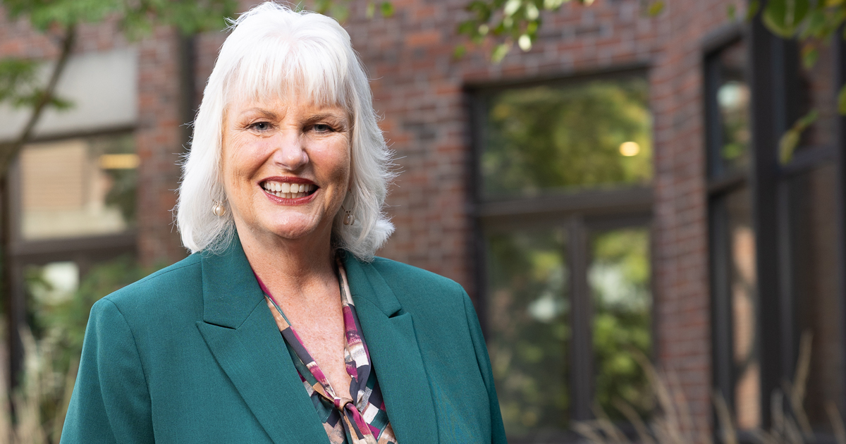 Sharon Sinnott poses for a portrait outside on campus