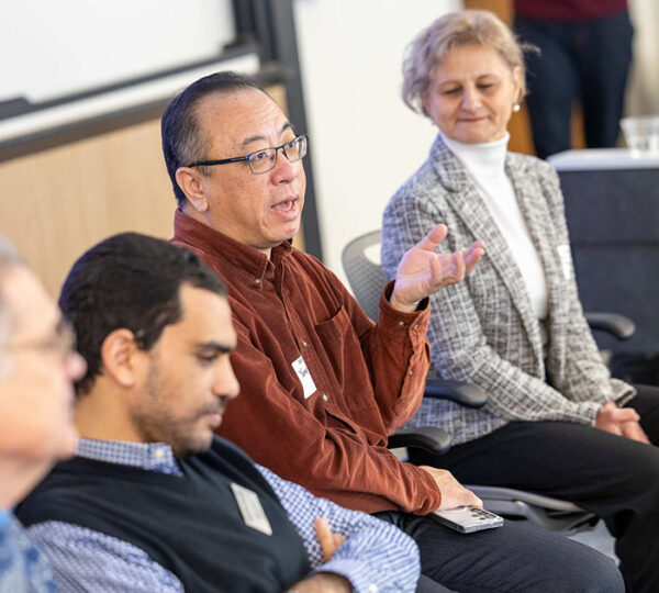 Babson faculty members discuss research methods.