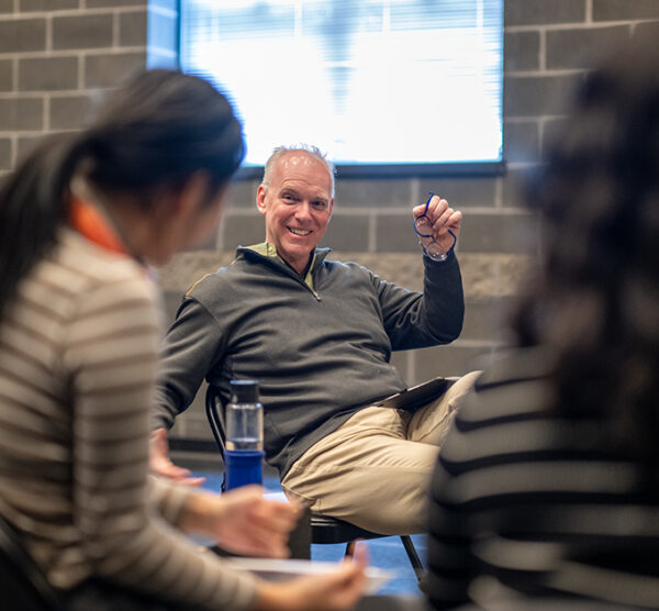 Man smiles during Project Empathy rehearsal.