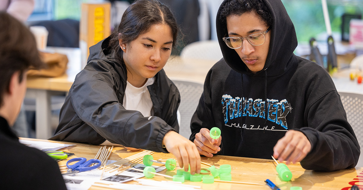 Two students collaborate on a project at the Weissman Foundry