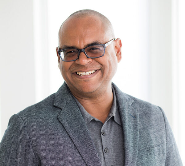 Portrait of a man who is a professor at Babson College discussing viral merchandising.