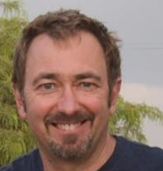 Portrait of bearded man, a professor at Babson College discussing viral merchandising.