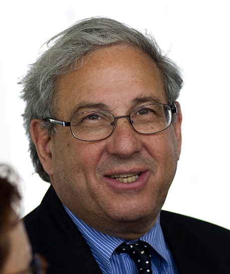 man in suit smiling.
