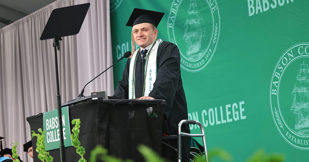 Jake Thibeault speaks behind a podium