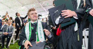 In the closing moments of Babson’s undergraduate Commencement ceremony last weekend, confetti rained down on Jake Thibeault ’26 and the other members of the Class of 2026. (Photo: Nic Czarnecki/Babson College)