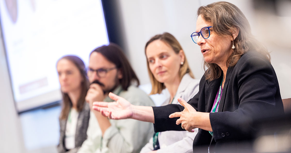 Nancy Baym is part of a four-person panel taking questions from an audience.