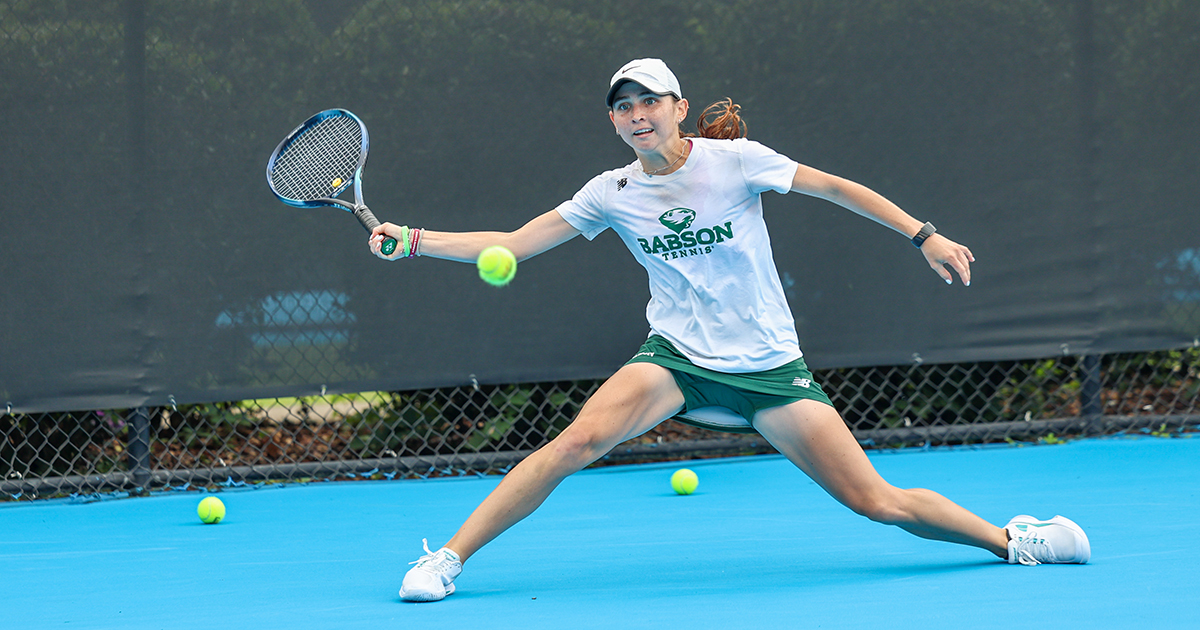 Matia Cristiani stretches with her racket to reach the ball on a return shot