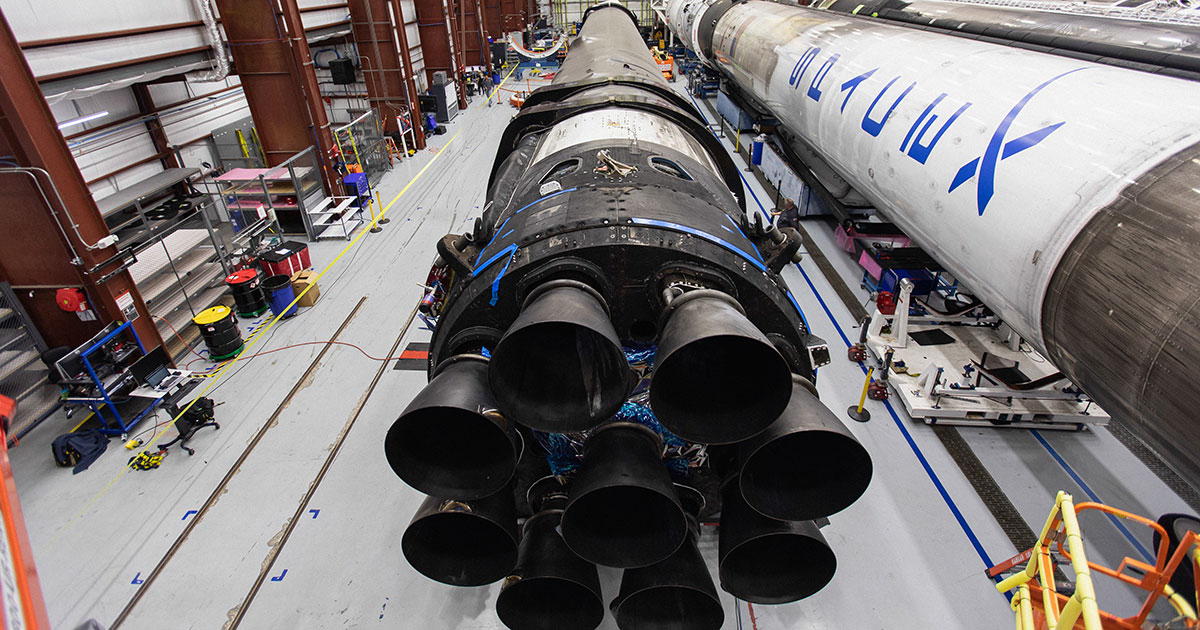 Rockets rest inside a SpaceX hangar