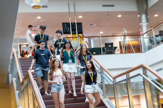 Young adults descend a stairwell at Babson
