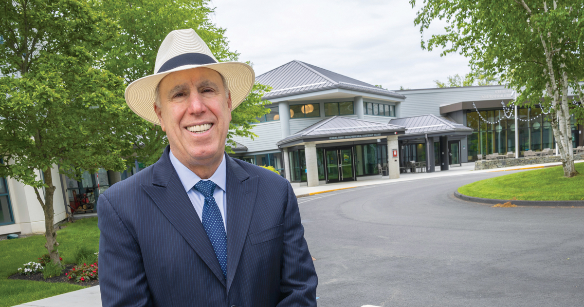 President Spinelli poses for a photo outside the Herring Family Entrepreneurial Leadership Village