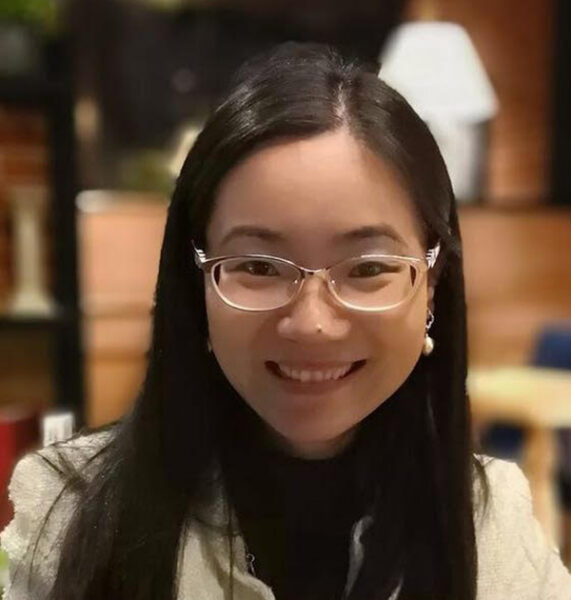 Smiling woman who is an associate professor of finance at Babson College.