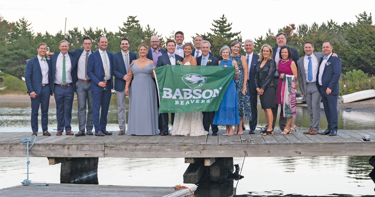 William Sparks and Tatum Reynolds pose for a wedding photo with friends and family
