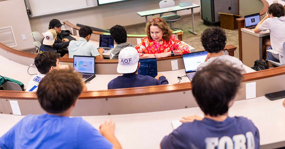 Ruth Gilleran talks with students in class