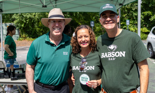 President Spinelli poses for a photo with two parents