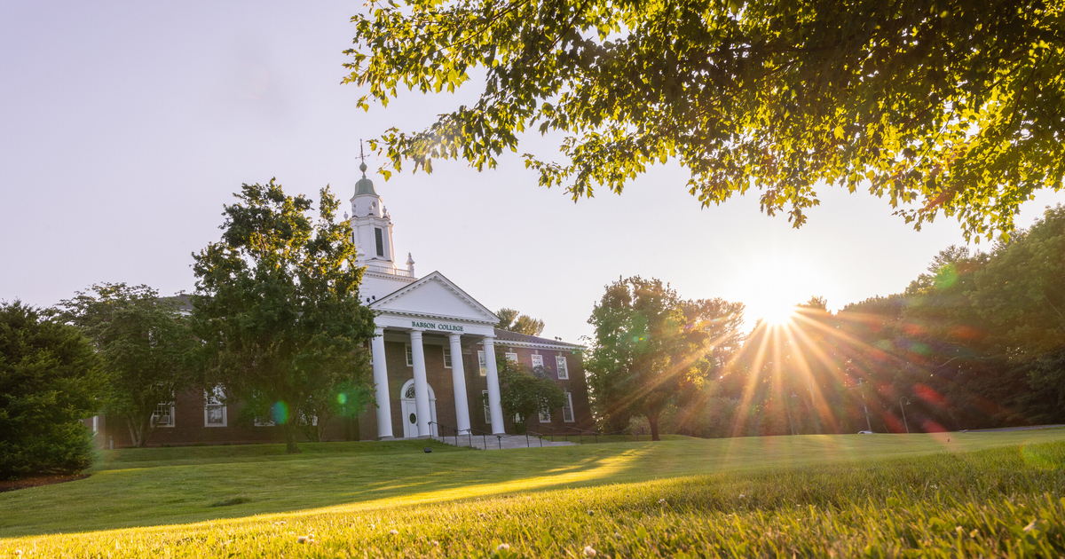 Tomasso Hall with the sun setting behind it