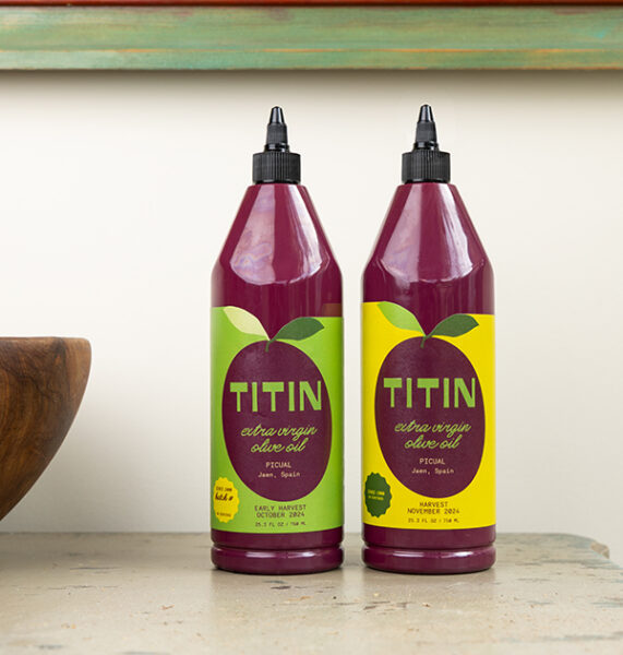 Two bottles of TITIN brand olive oil, a company created by Babson alumnus Daniel Danes MBA'24.