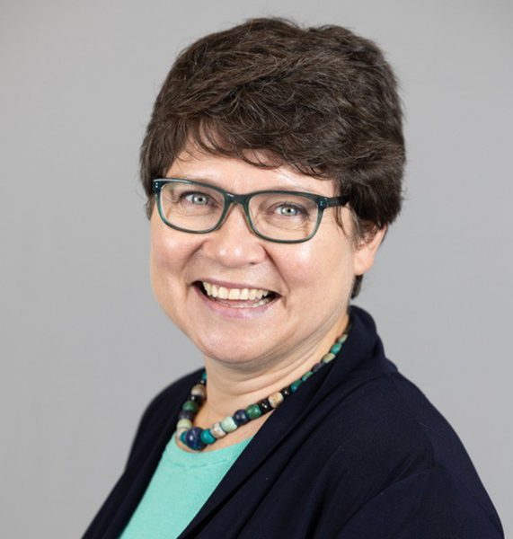 Middle aged woman with glasses smiling career coach at Babson College.