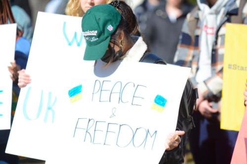 A community member holds a sign at the student-led Ukraine demonstration on March 8, 2022.